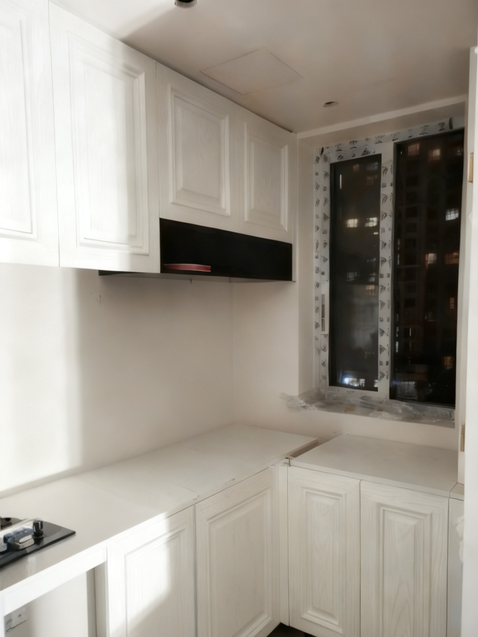 Kitchen: white wall cabinets and base cabinets
