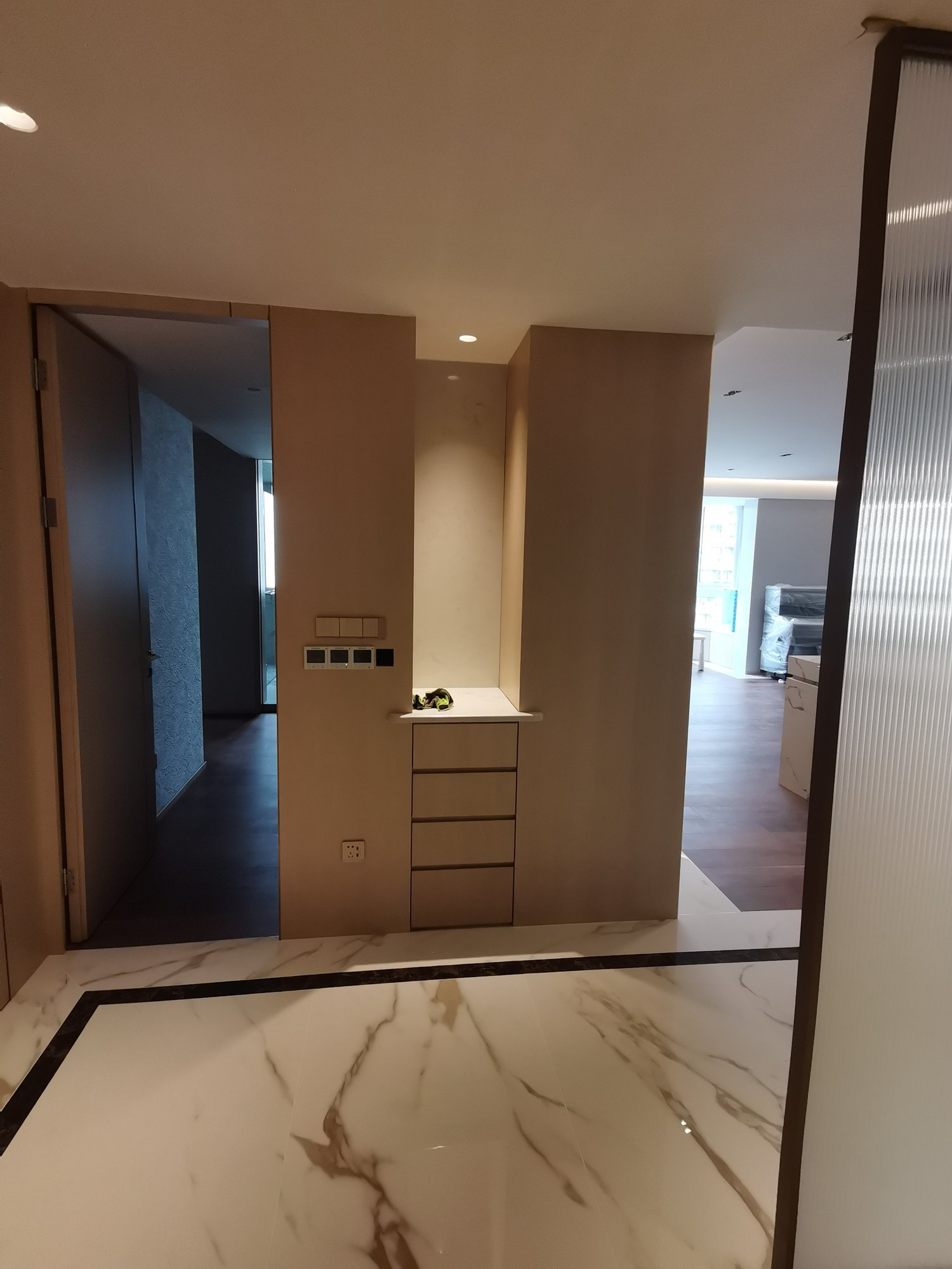 Entryway custom drawer cabinet and surrounding wall panels