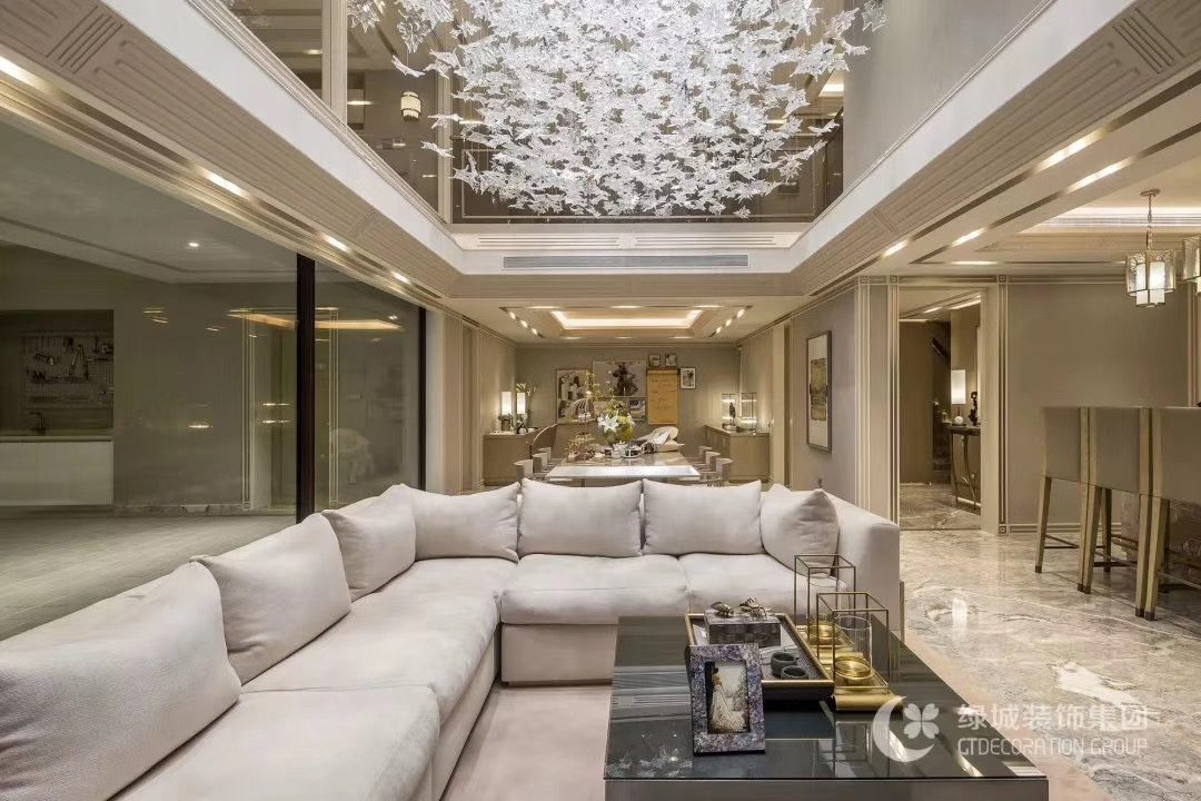 Living room custom cabinetry and wall paneling throughout.