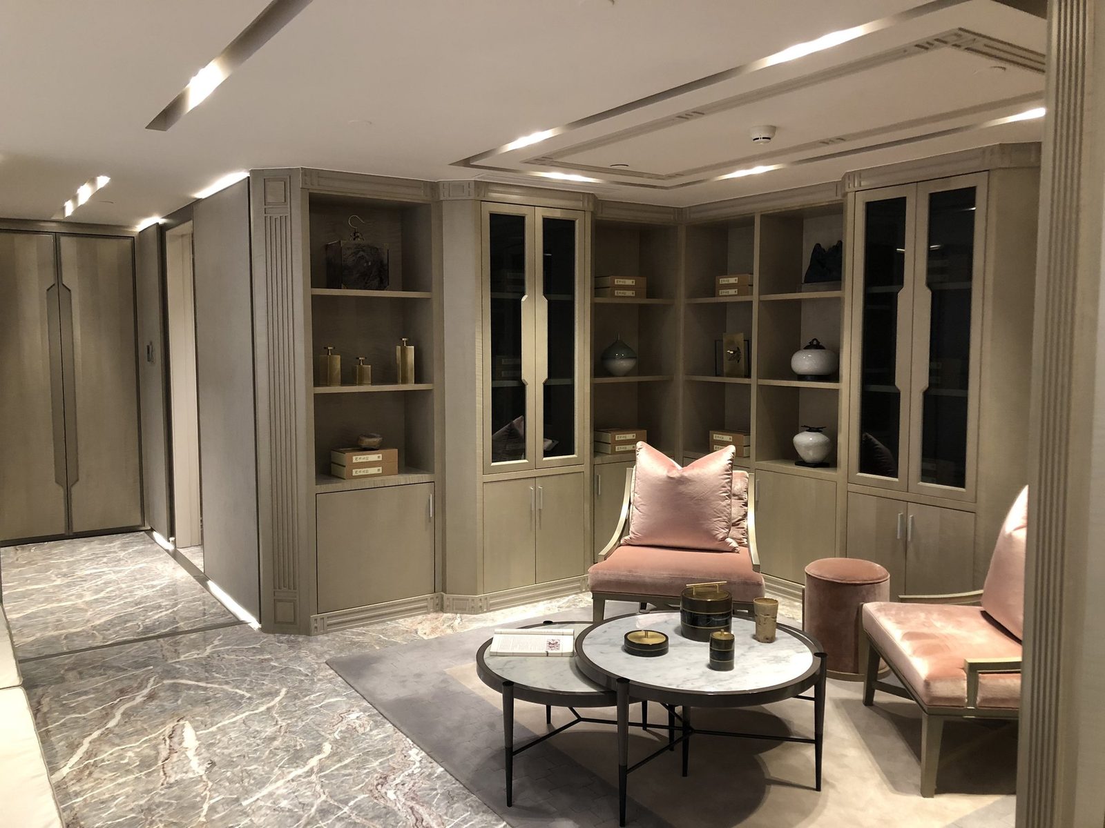 Living room custom display shelving, bookcase, and storage cabinets.