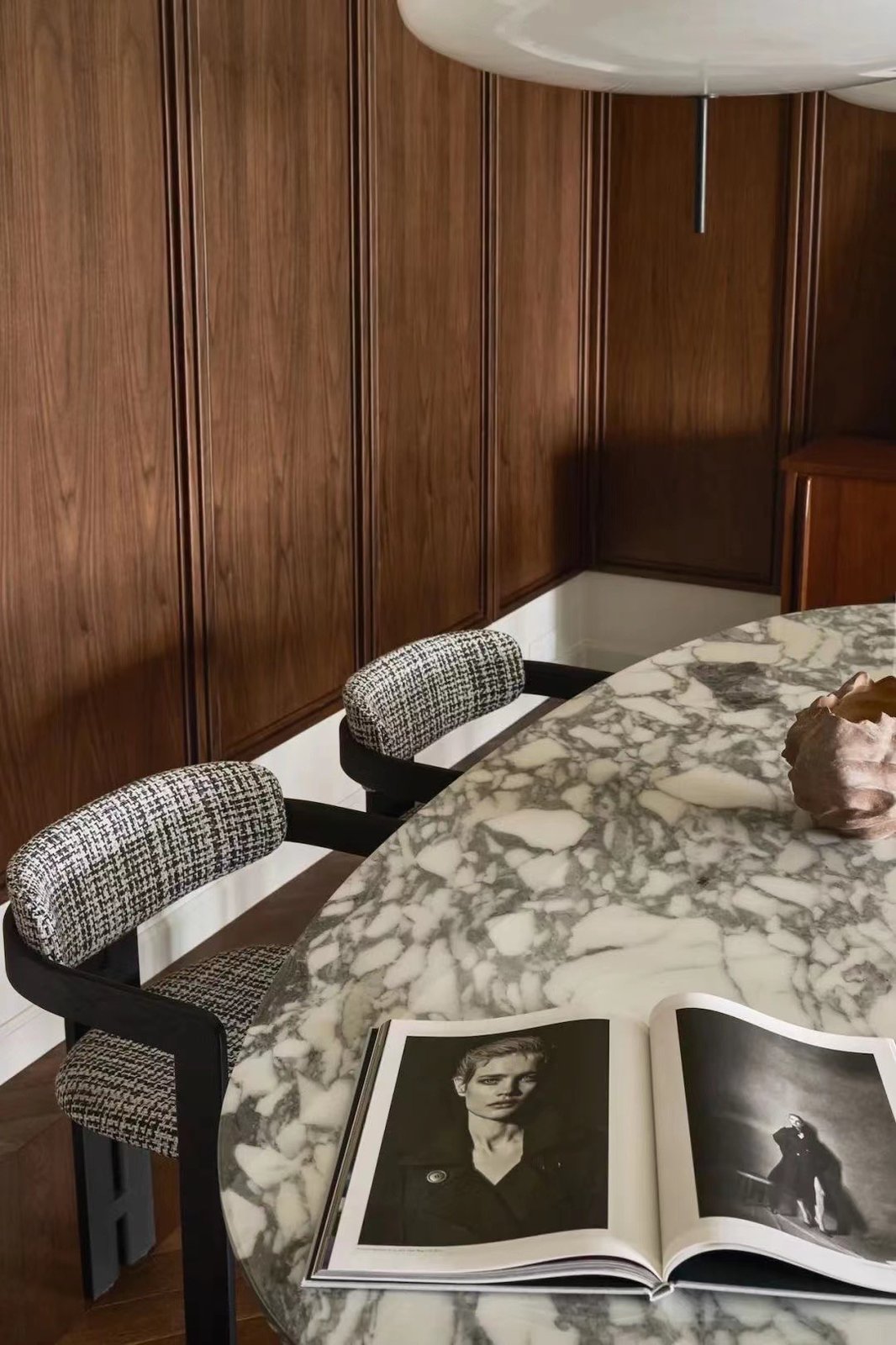 Dining room custom wall paneling with dining table and chairs