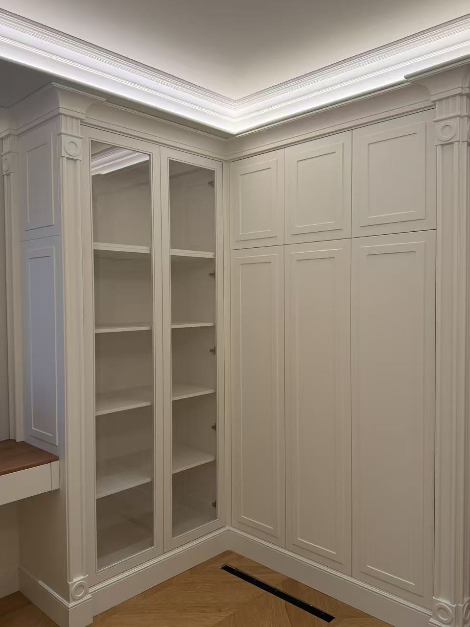 Study with custom corner cabinet and open glass shelving