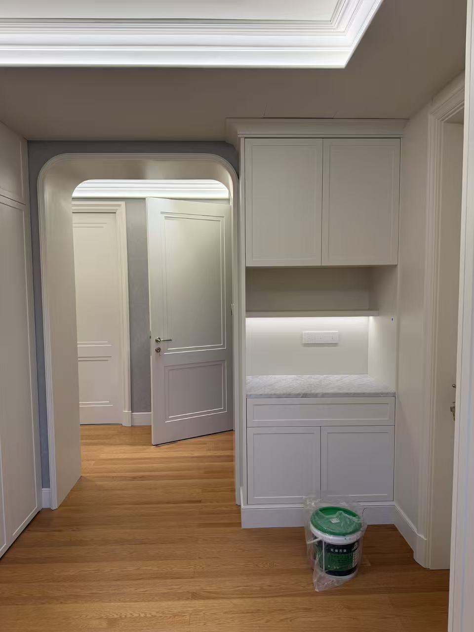 Entryway with custom wall cabinets and low cabinets