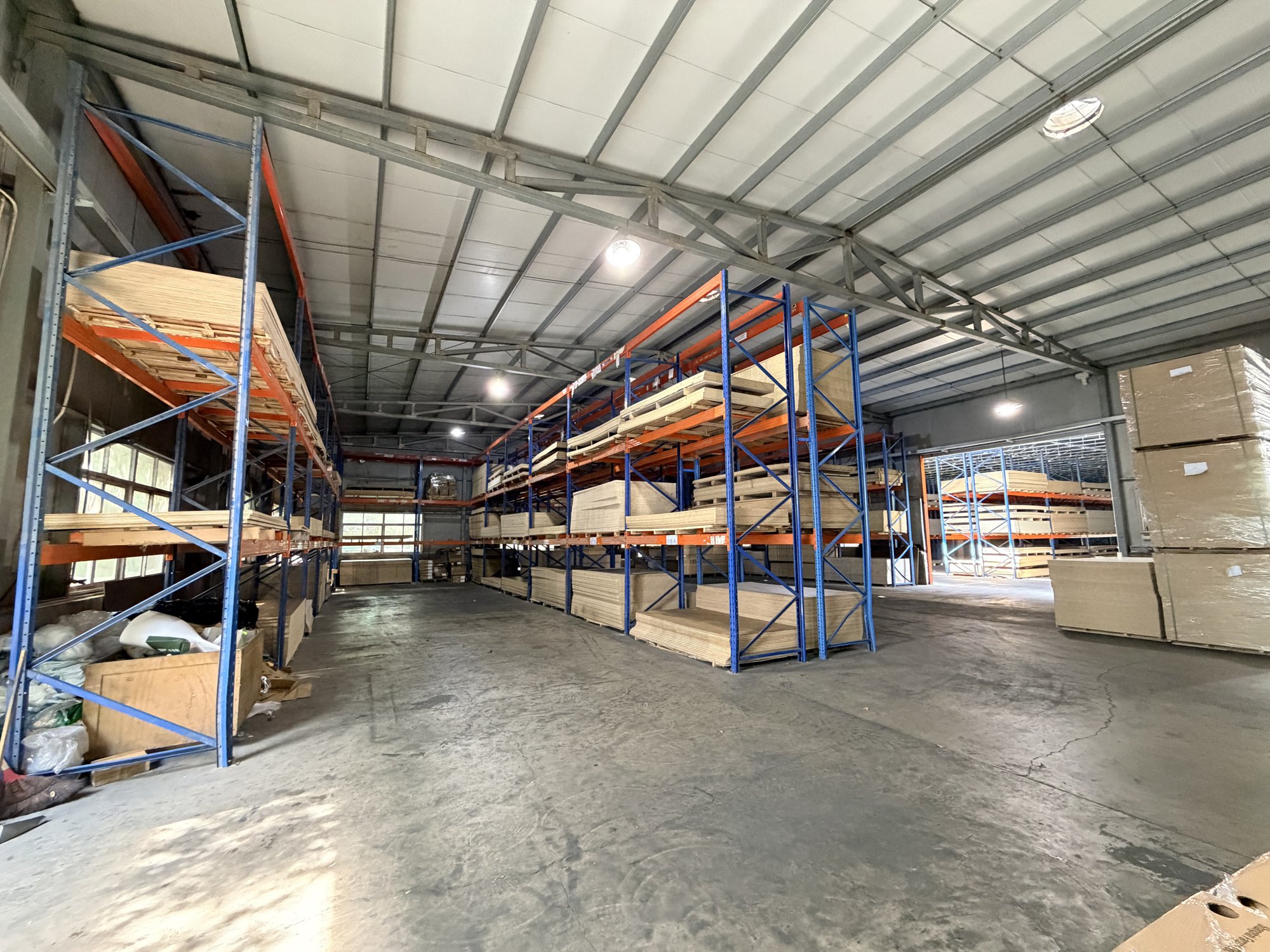 Board warehouse with racked panel storage