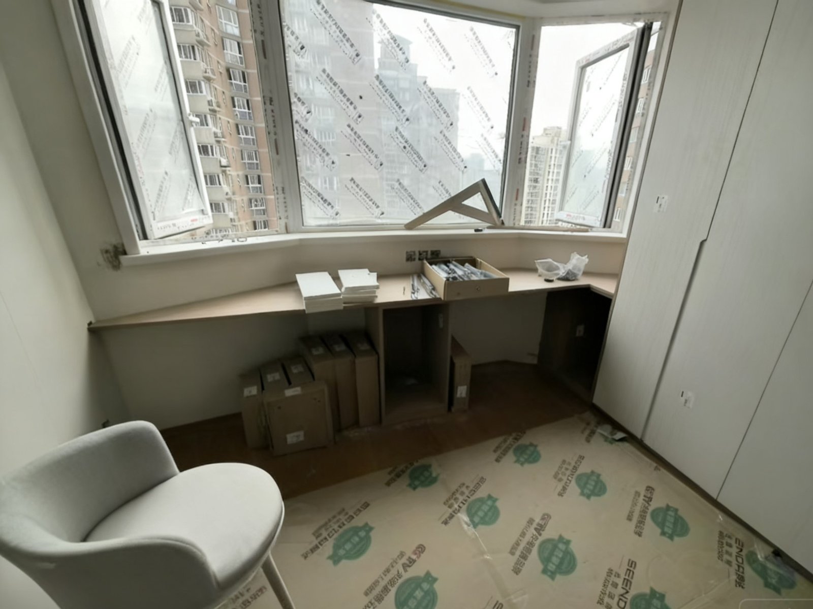 Master bedroom: custom writing desk and cabinet units during installation