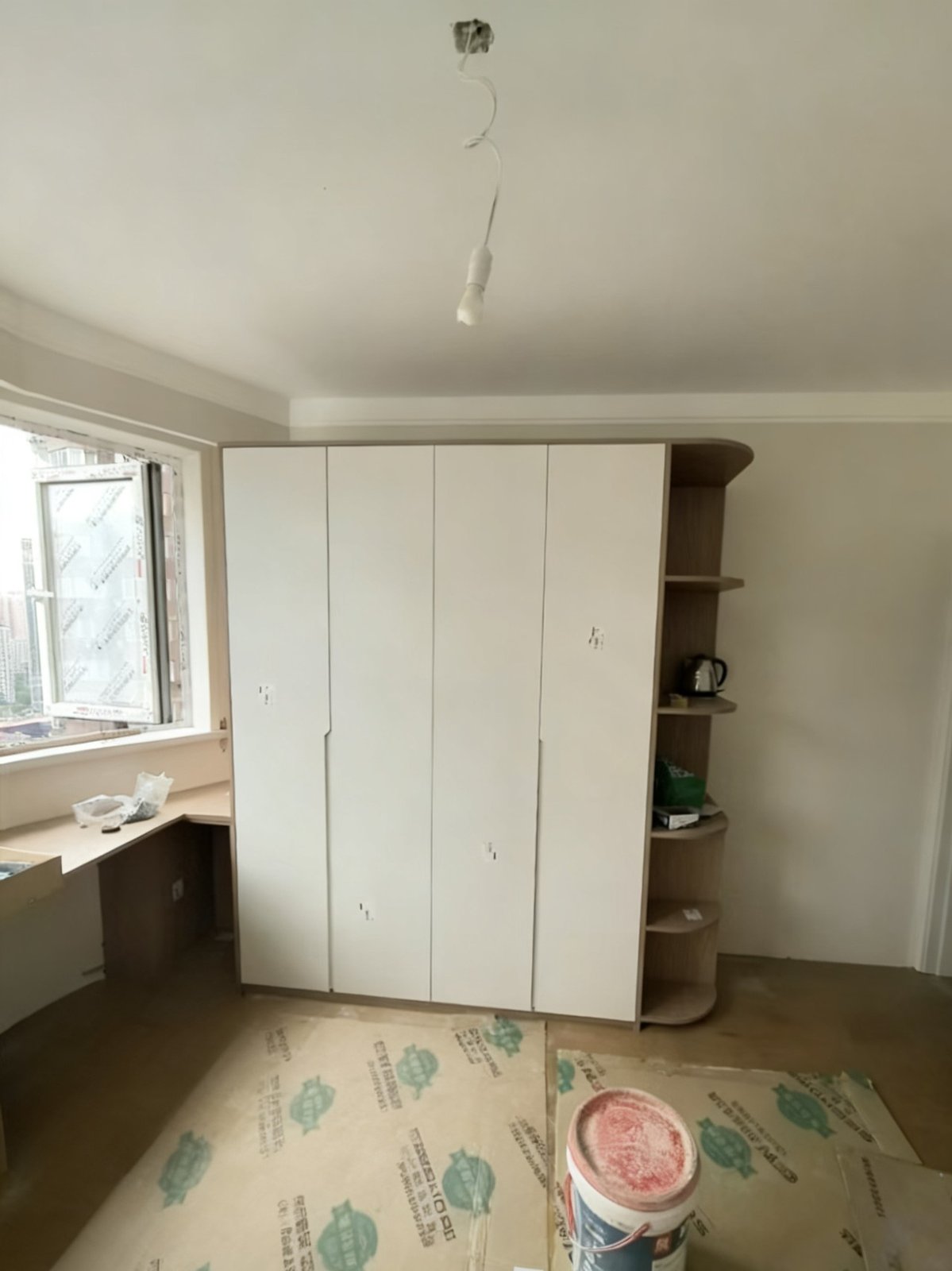 Master bedroom: custom wardrobe with matching desk cabinet on left